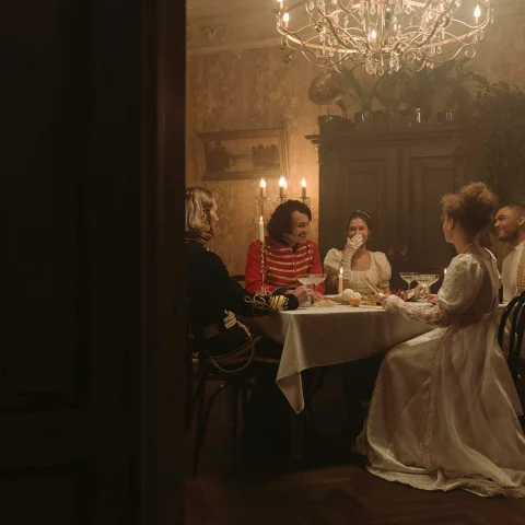 Dinner scene in a costume drama
