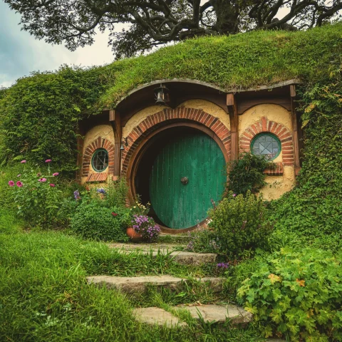 A Hobbit's hole, a house built into a mound with greeneries