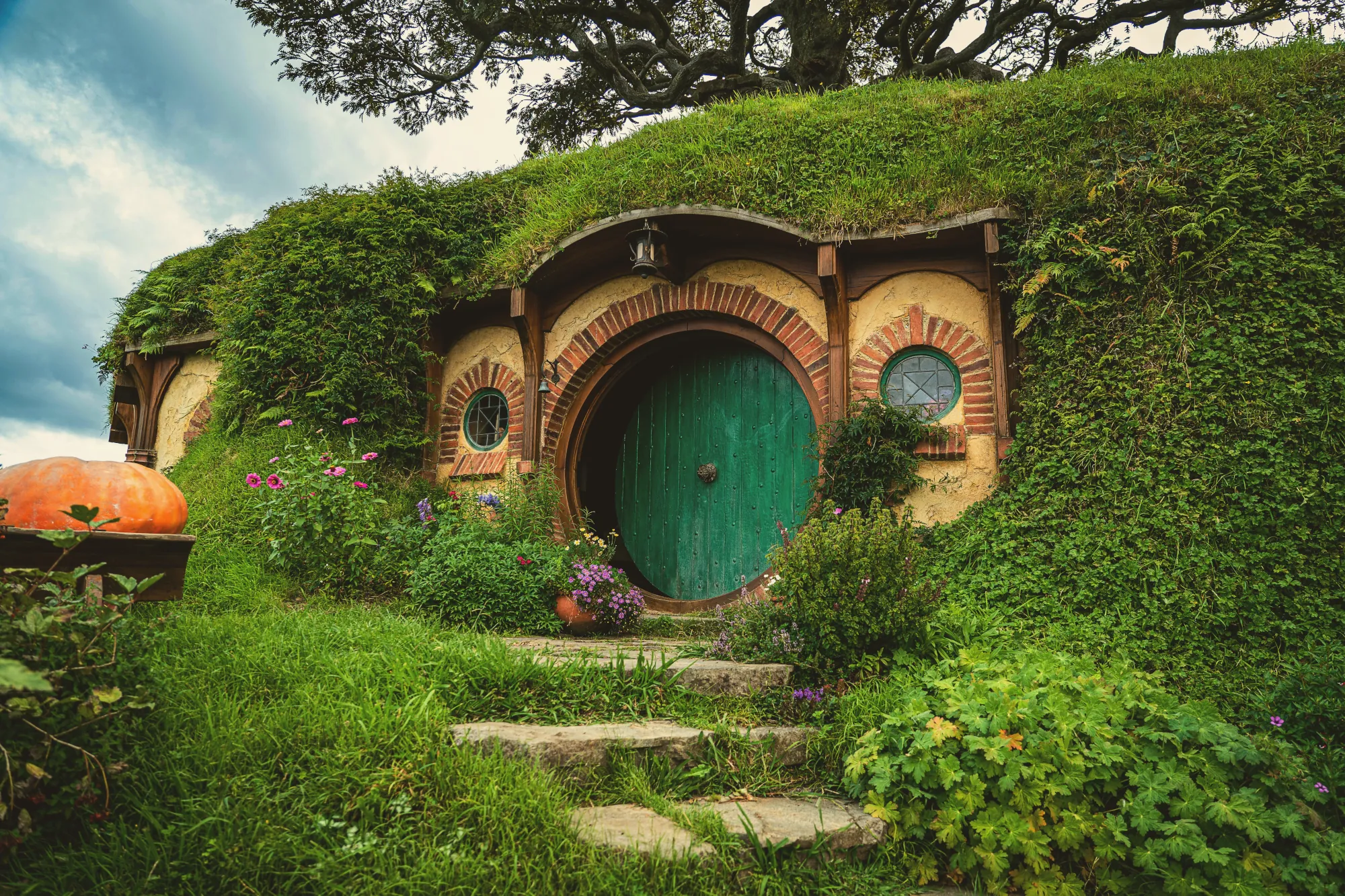 A Hobbit's hole, a house built into a mound with greeneries